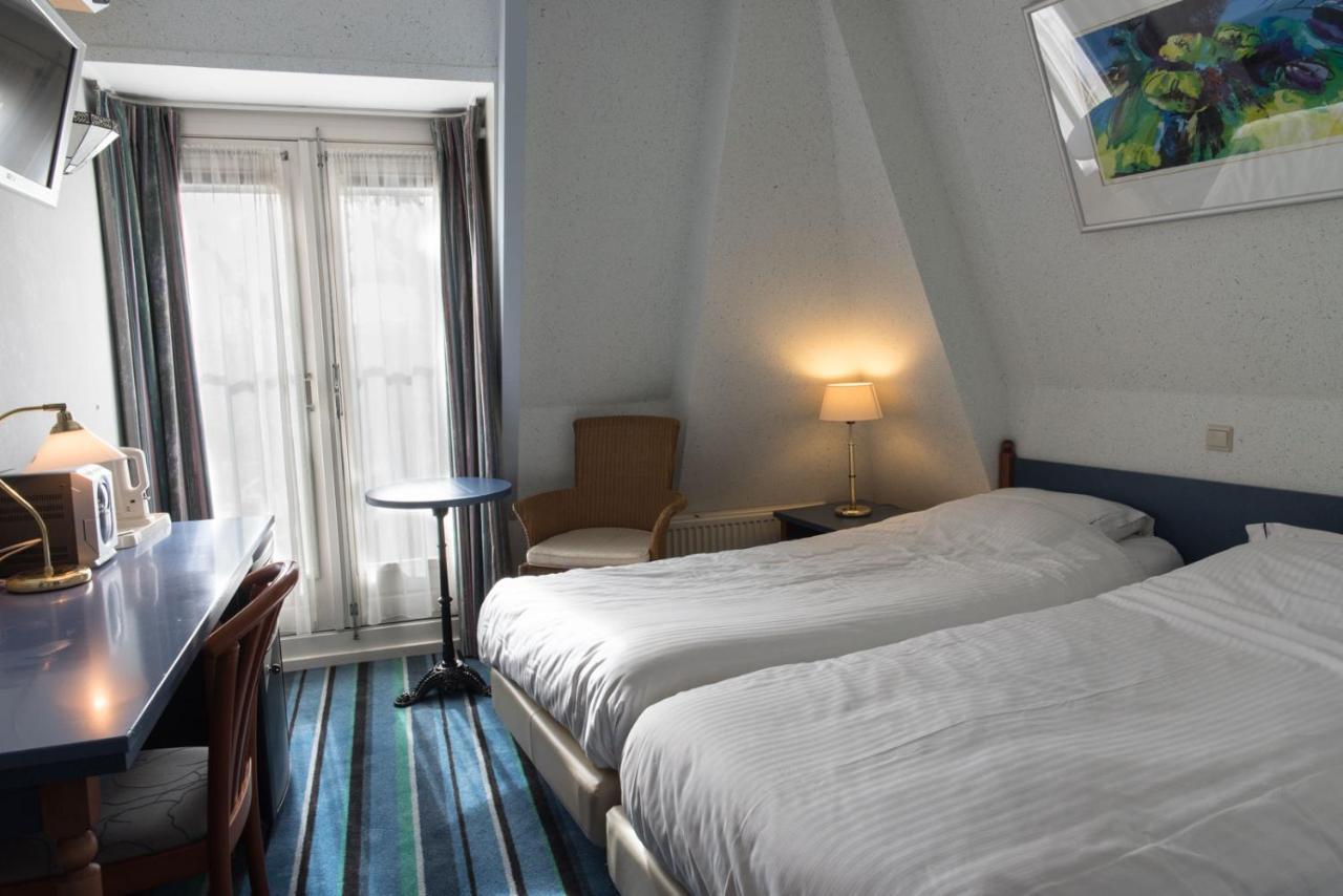 Kleine Tweepersoonskamer met 2 Aparte Bedden