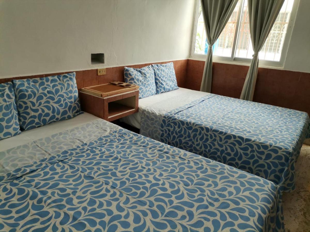 Chambre Standard 2 Lits Doubles avec Climatisation - Vue sur Jardin
