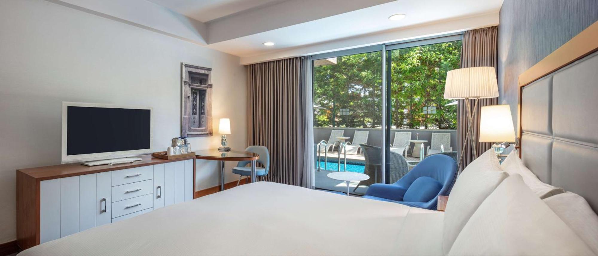 Deluxe Zimmer mit Kingsize-Bett und Sonnenterrasse