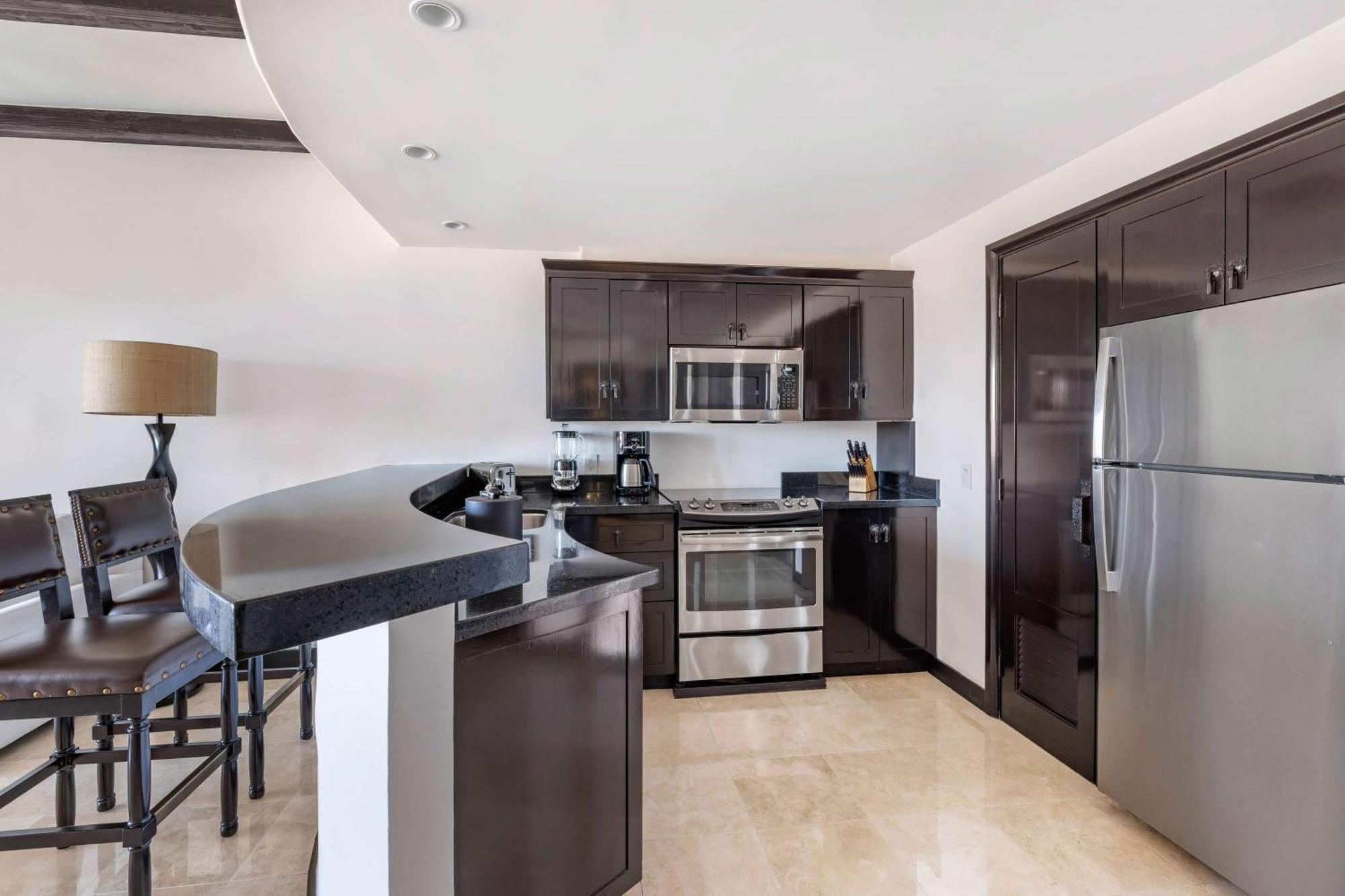 One Bedroom Deluxe King Suite with Pool View and Balcony