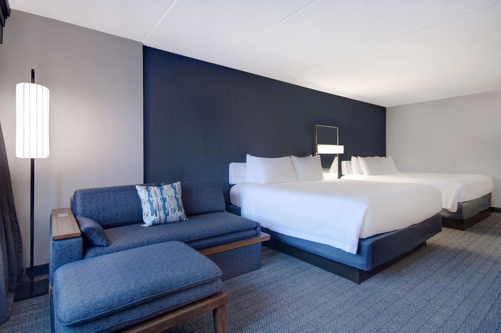 Room with Two King Beds and Sofa Bed