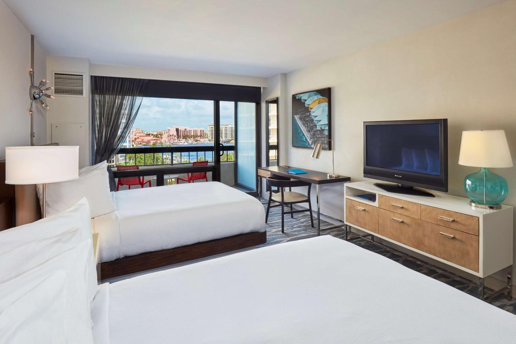 Queen Room with Two Queen Beds, Balcony, and Water View