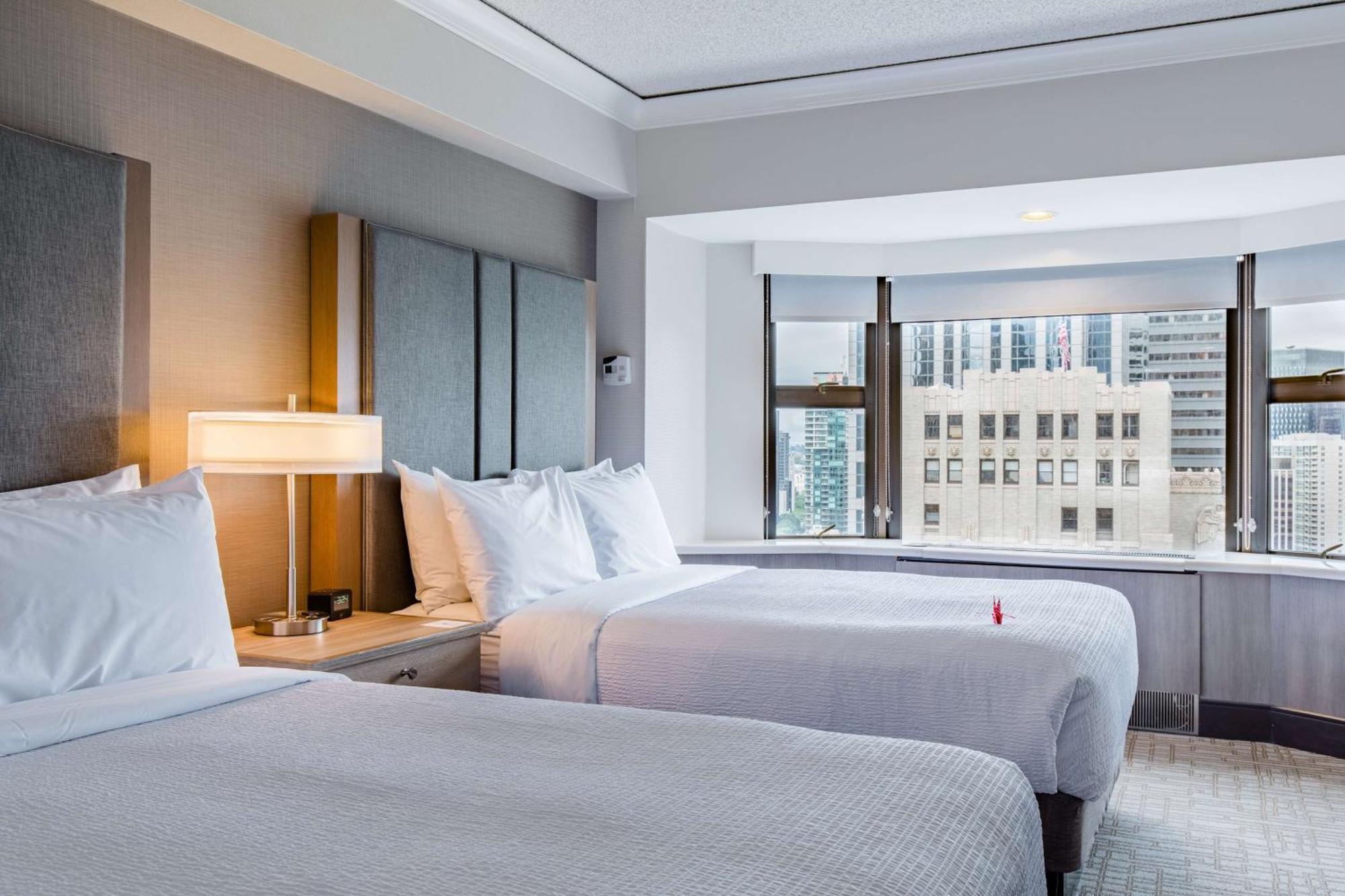 Executive Doppelzimmer mit 2 Doppelbetten und Stadtblick