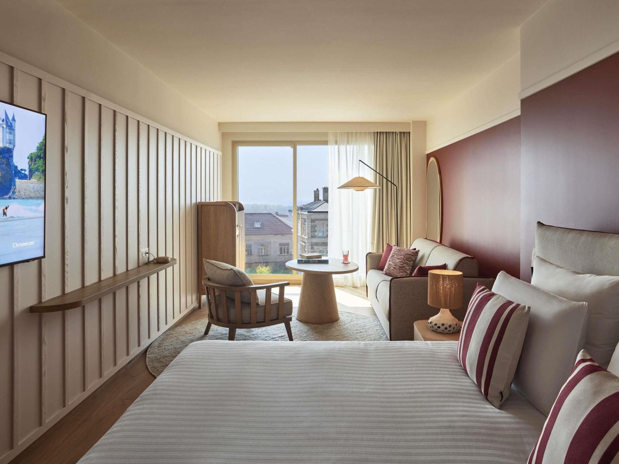 Suite Junior con sofá cama y vistas al mar - Cama extragrande