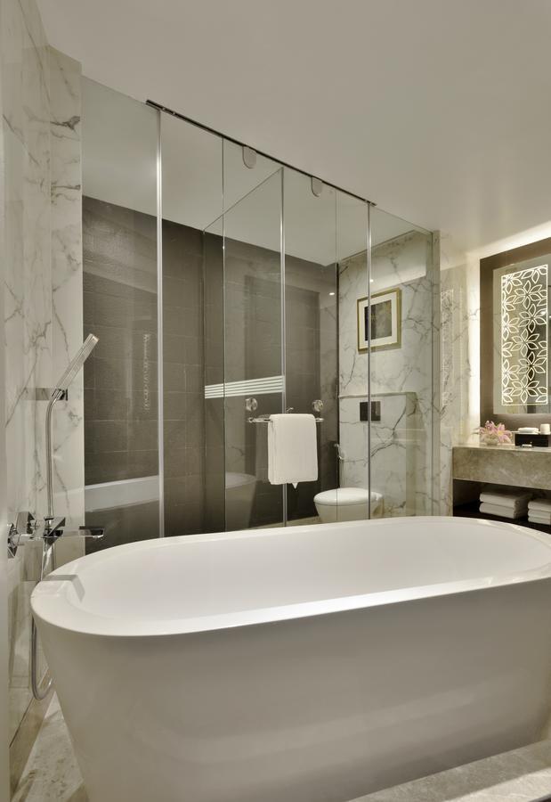 Deluxe King Room Bed with 15% discount on food, beverages, laundry and spa