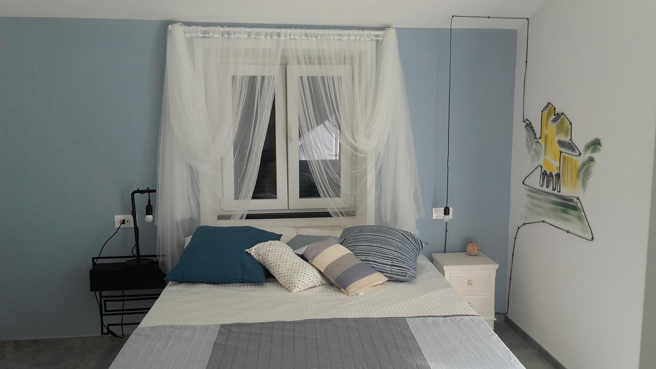 Camera Matrimoniale con Balcone (2 Adulti + 1 Bambino)